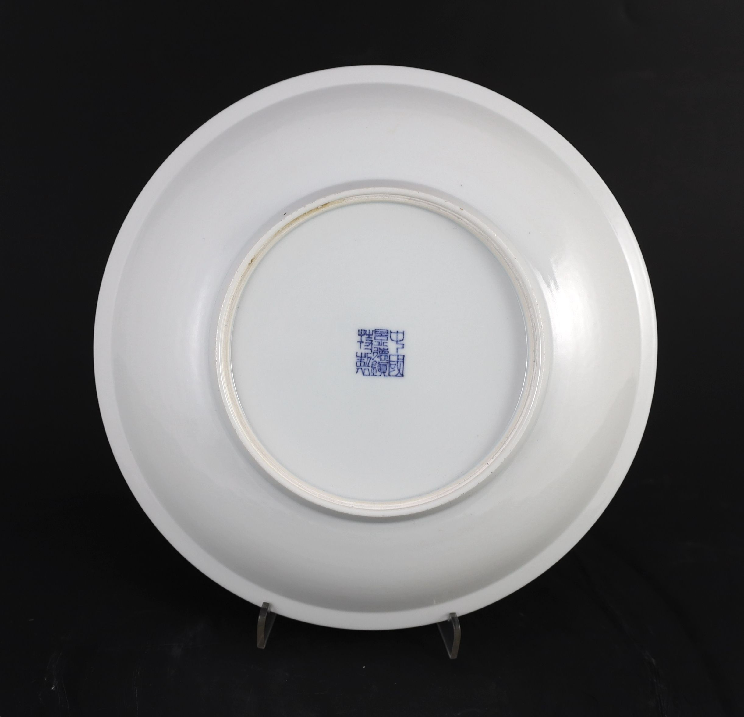 A Chinese iron-red underglaze plate, 25.5 cms diameter.